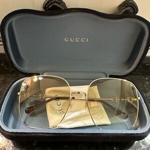 Gucci Women's Sunglasses with Gold Frame